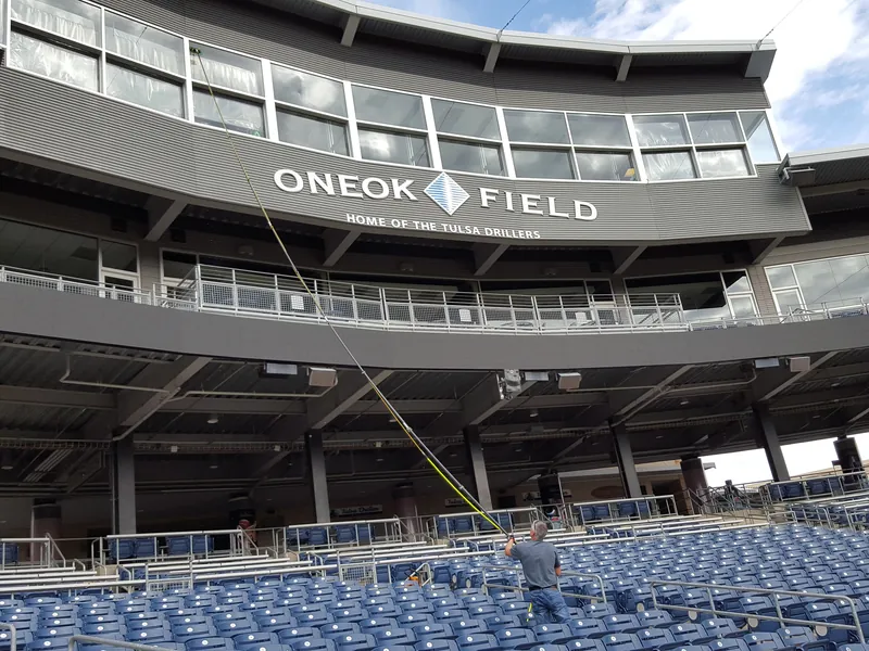 A water-fed pole reaching the upper-deck glass at ONEOK Field, home of the Tulsa Drillers.