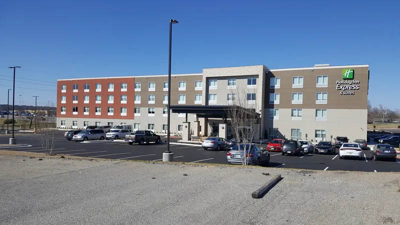 A four-story hotel and its parking lot on 71st Street in Tulsa.